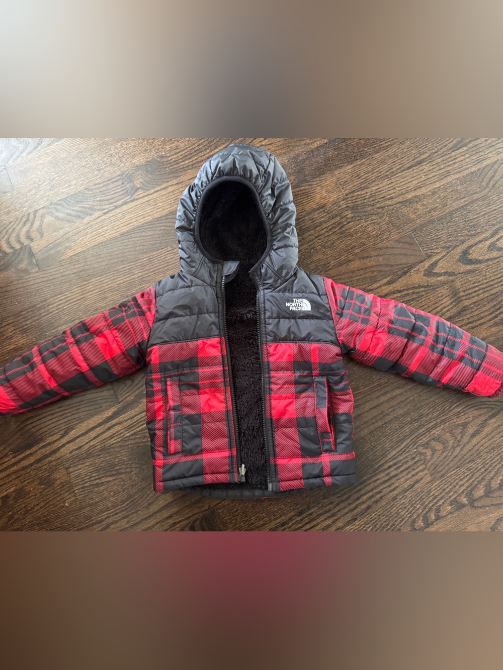 The North Face Kids Red and Black Plaid reversible Puffer Jacket with Hood